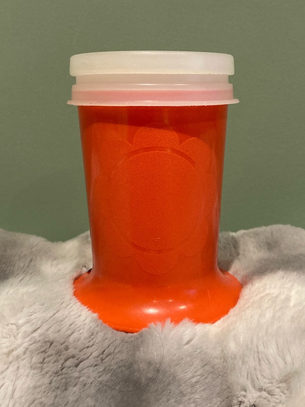 Bright Orange vintage Tupperware model #1318 footed sippy cup with original lid